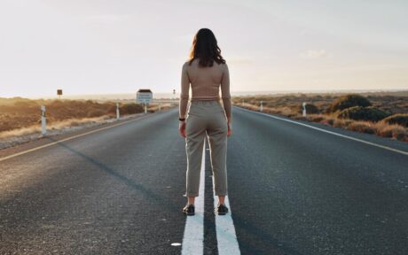 person standing at the start of a new journey